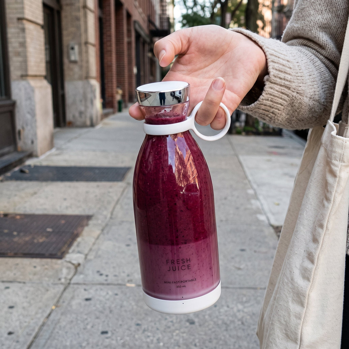 Carrying a White Swirlette smoothie down a city sidewalk.