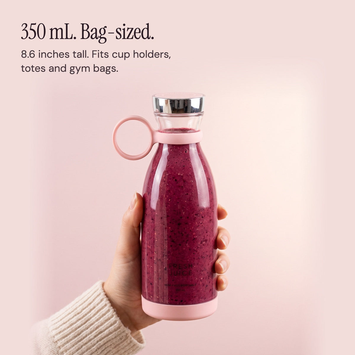 A hand holding the 350 mL Blush Swirlette to show its size.