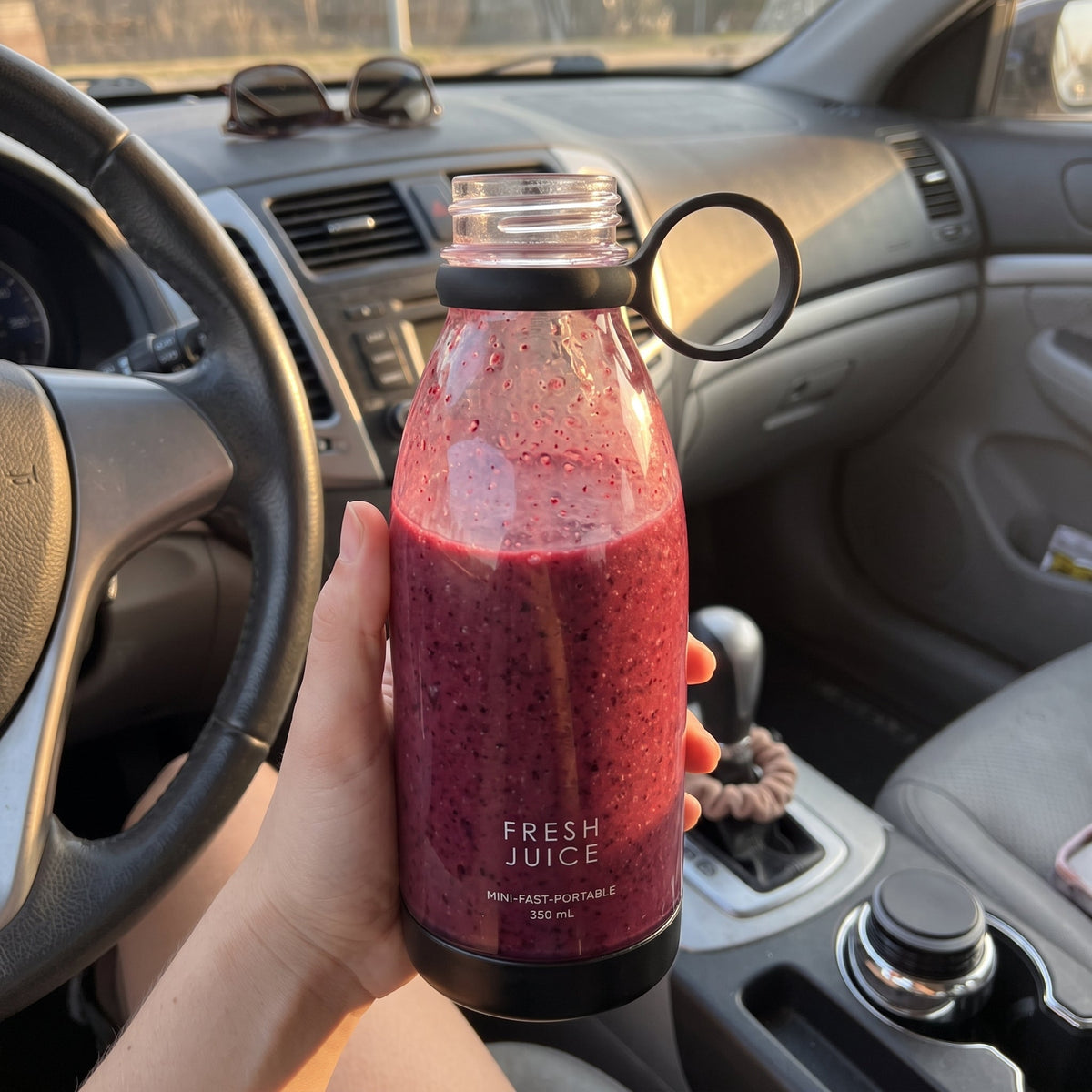 Holding a Black Swirlette full of berry smoothie in the car. [Black]